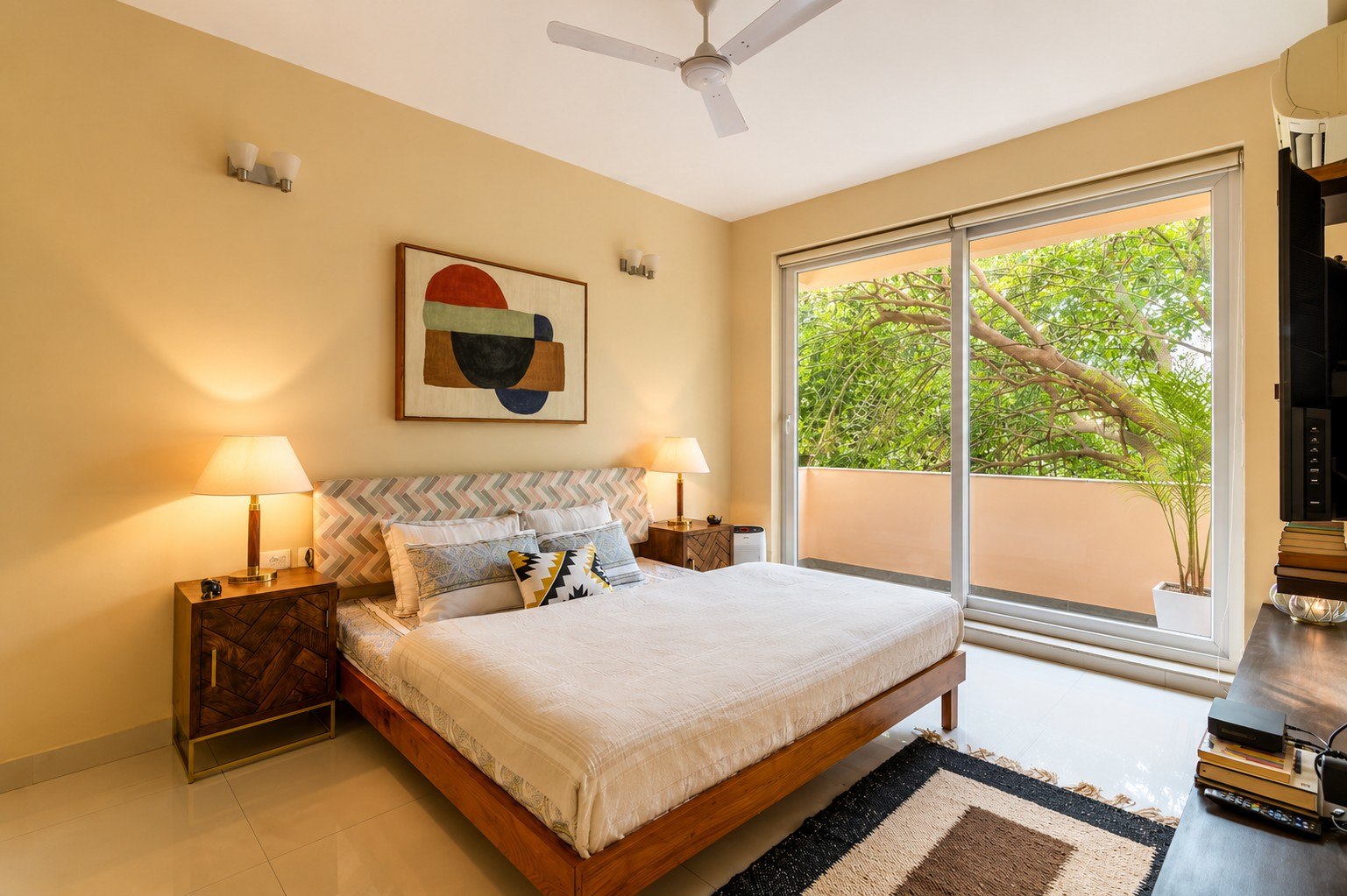 Comfortable sleeping space with natural light, window, and seating.