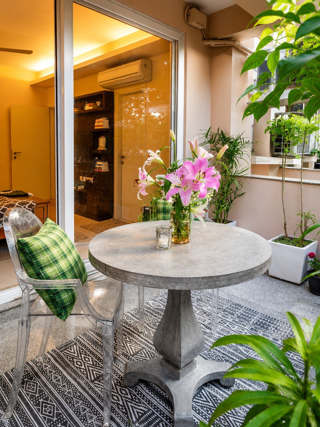 Alternate view of the outdoor dining setting and doorway approach.