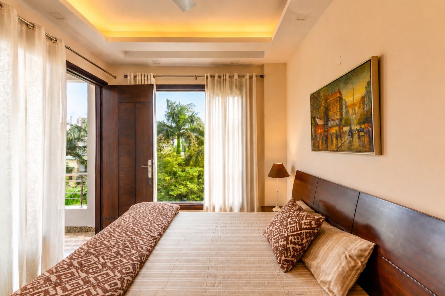 Sleeping space opening toward a balcony or green outlook.