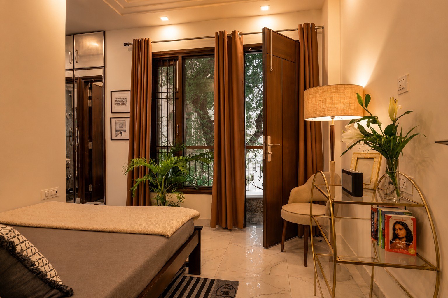 Bedroom view with natural light, curtains, and a doorway detail.