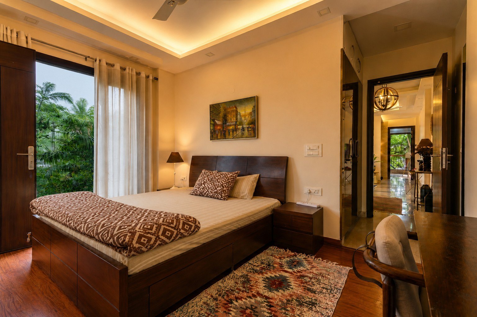 Bedroom with a bed, chair, and warm residential details.