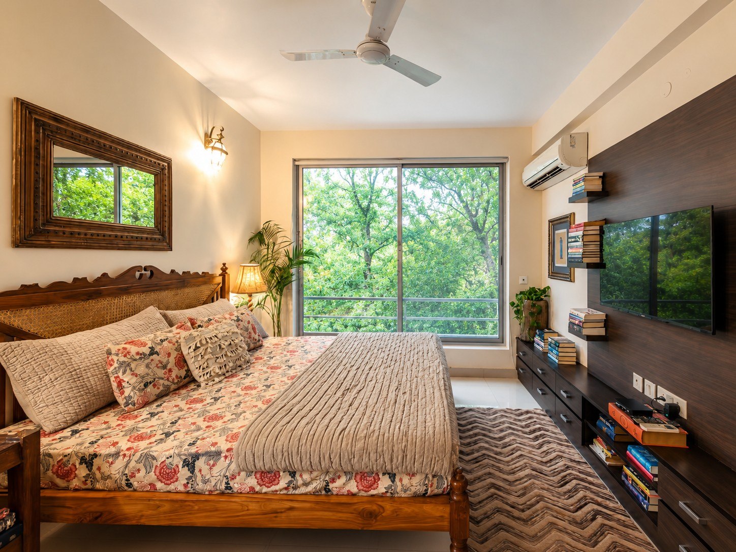Alternate view of the same bedroom with television wall and storage.